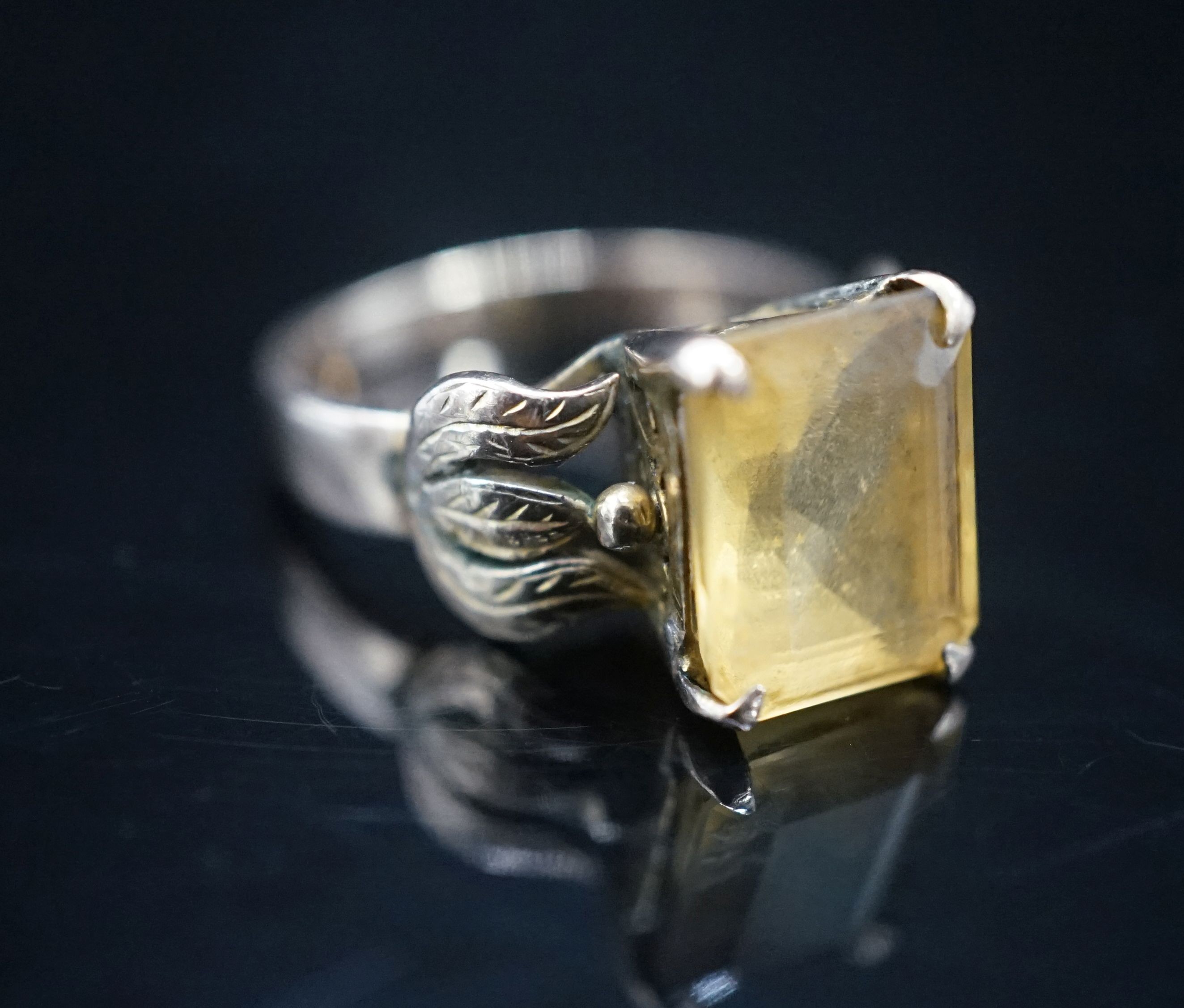 A 14k yellow metal and citrine set dress ring, size M, gross 4.9 grams.